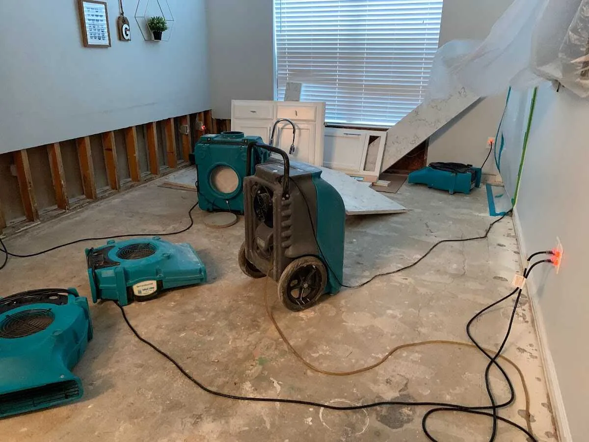 Dehumidifier in flood-cut room for Water Damage Restoration in King