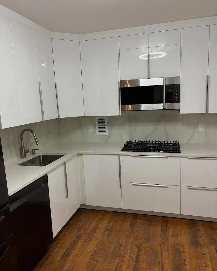 Restored kitchen with white cabinets after water damage in King